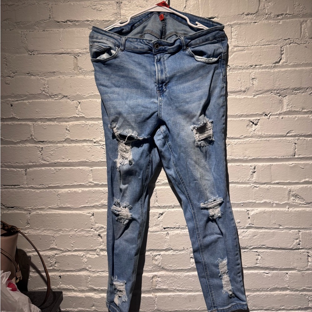 Ripped light wash blue jeans